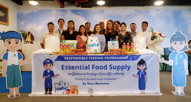 a group of people standing with essential foods