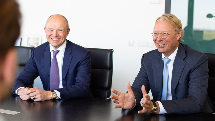 two men are answering happily interview questions